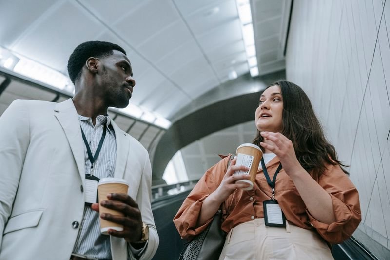 Colleagues communicating politely in an office setting