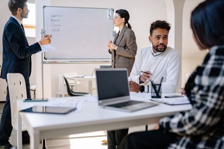 Business professionals having a polite conversation in a workplace meeting
