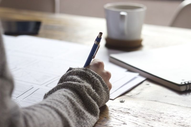 Student at laptop puzzled by commonly confused English word pairs like affect and effect