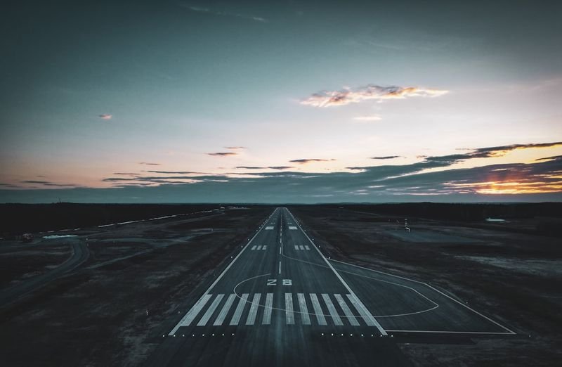 take off phrasal verb - airplane taking off at runway