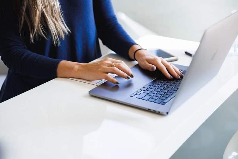 take up phrasal verb - person working on laptop starting new activity