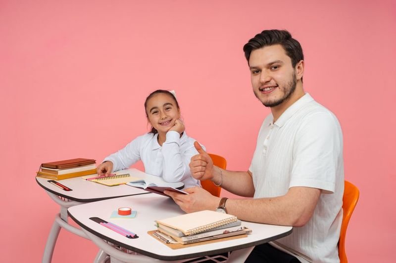 Teacher's pet idiom — student receiving praise from teacher in classroom