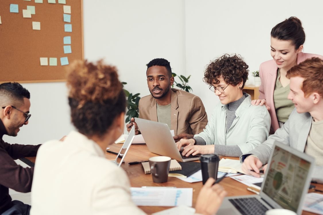 Business team celebrating success with technology