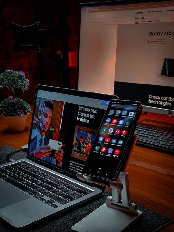 Computer laptop and smartphone on a clean office desk