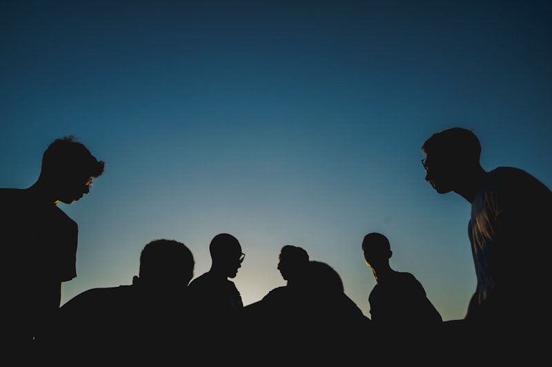 War of words English idiom — silhouettes of people in a heated public debate